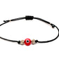 Red evil eye with silver beads in black cotton